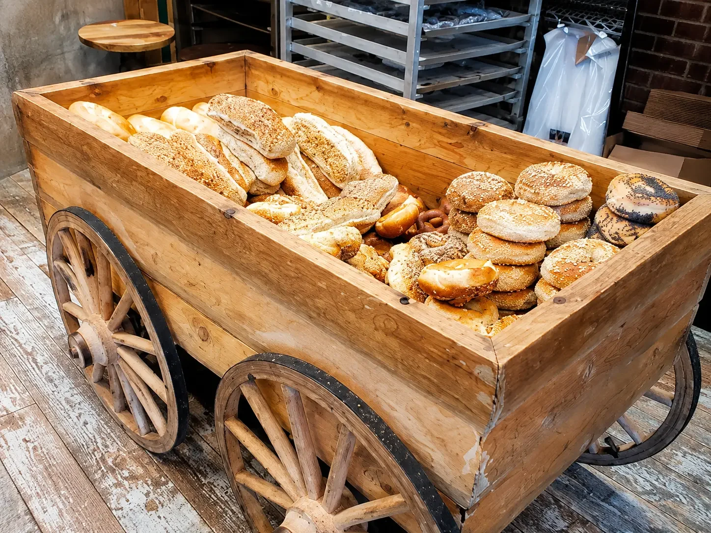Bakery cart stacked with fresh breads and rolls