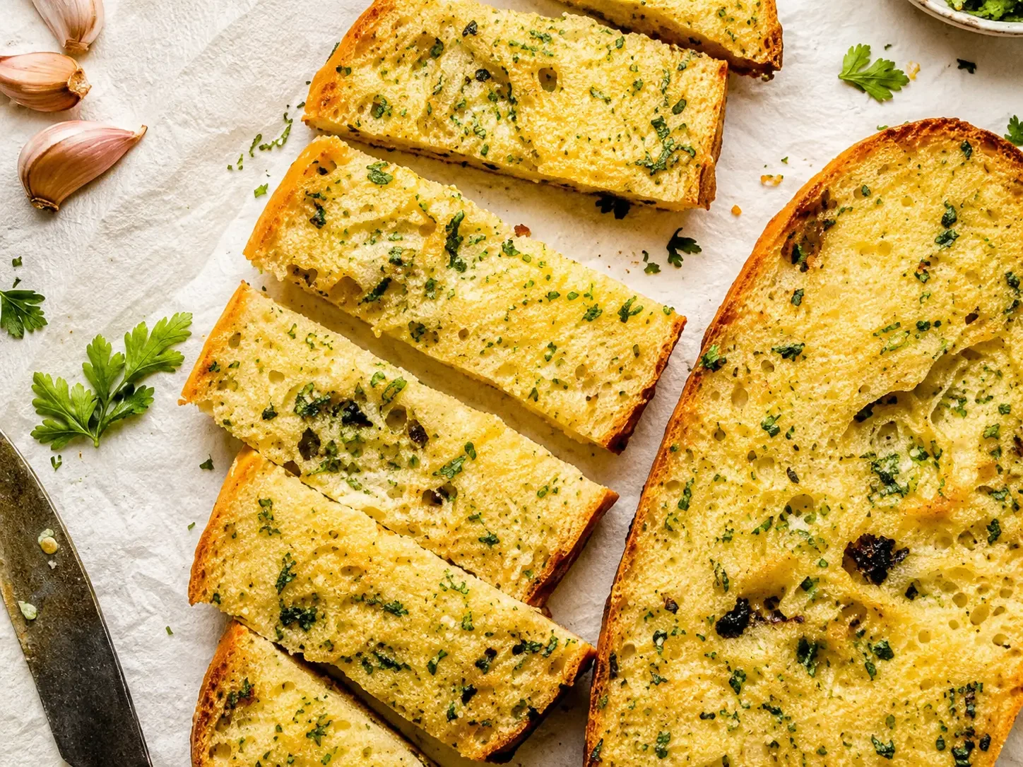 Garlic bread and savory baked items on the bakery counter